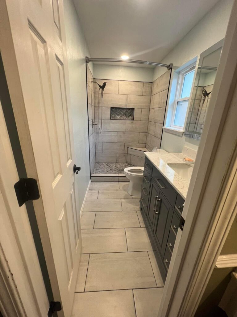 Walk-in shower bathroom remodel with modern vanity
