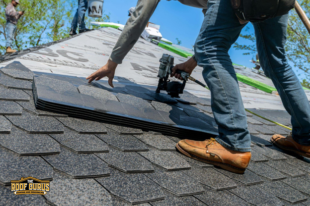 Roofing contractor examining shingles and roof surface during an inspection in Amarillo